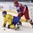 POPRAD, SLOVAKIA - APRIL 23: Sweden's Jacob Peterson #25 is checked to the ice by Russia's Alexander Klisunov #18 during bronze medal game action at the 2017 IIHF Ice Hockey U18 World Championship. (Photo by Andrea Cardin/HHOF-IIHF Images)